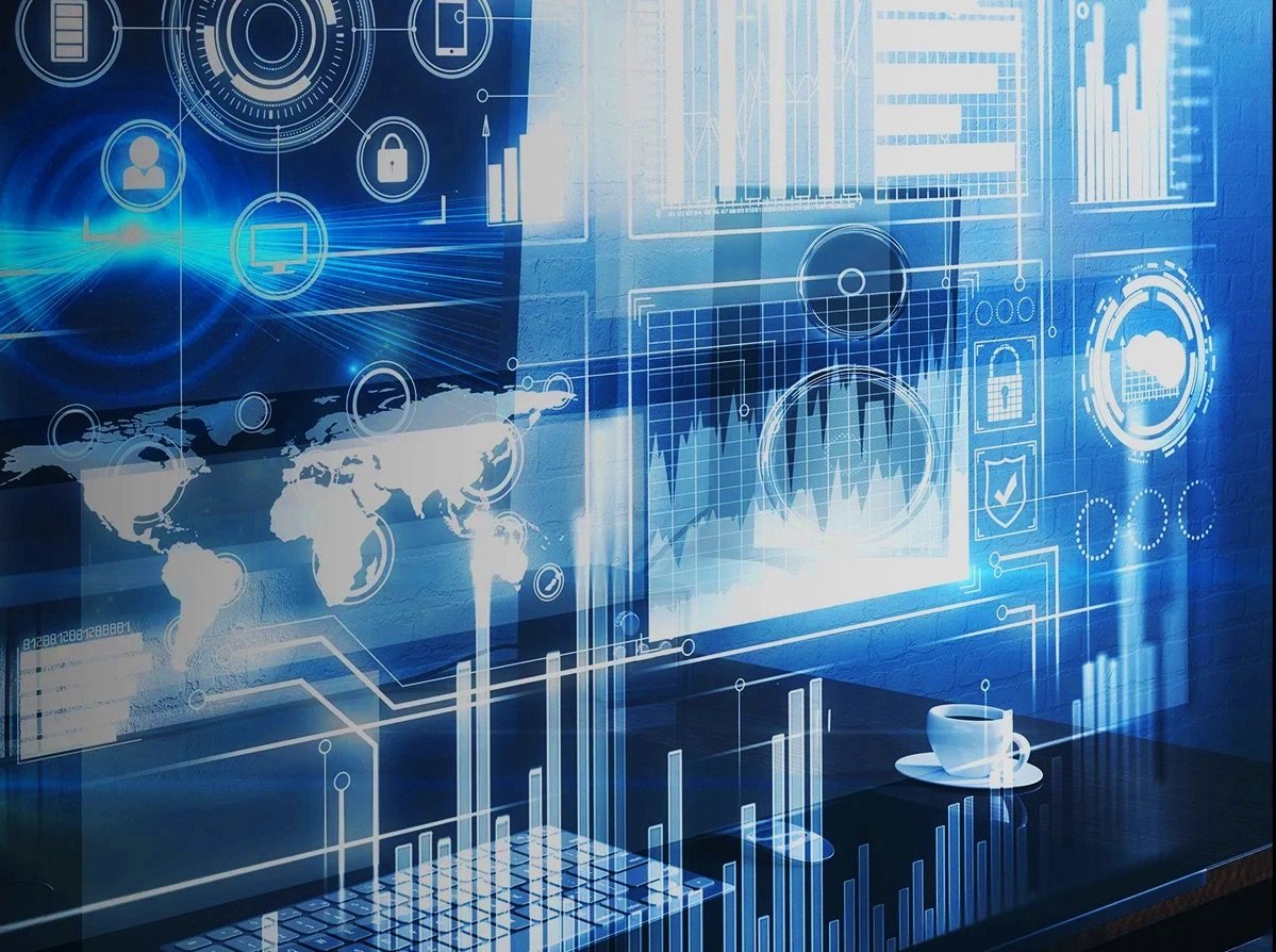 Bar charts, line graphs, radial gauges and a world map composited in translucent overlay above a desk with a keyboard and a coffee cup
