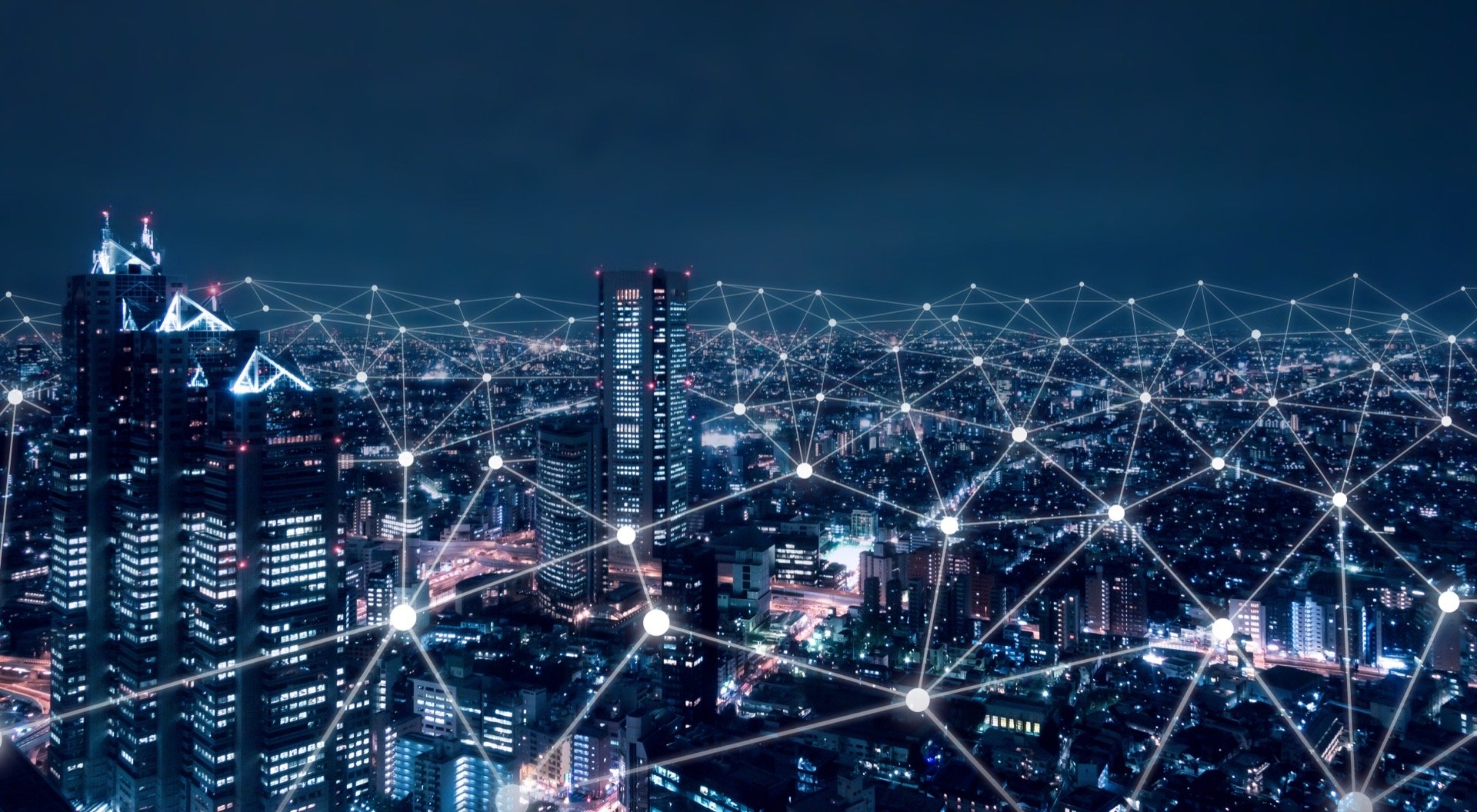 A night-time city skyline overlaid with a connected network of nodes and lines