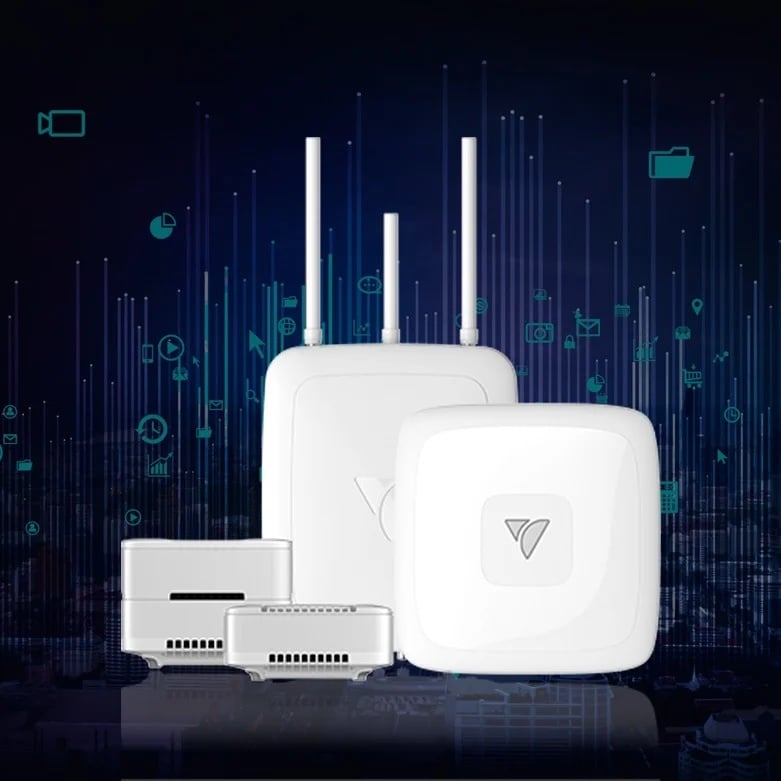 The VeeaHub family — two compact units, a flat indoor unit and an antenna-equipped outdoor unit — against a dark teal backdrop of app icons and light streaks above a city skyline
