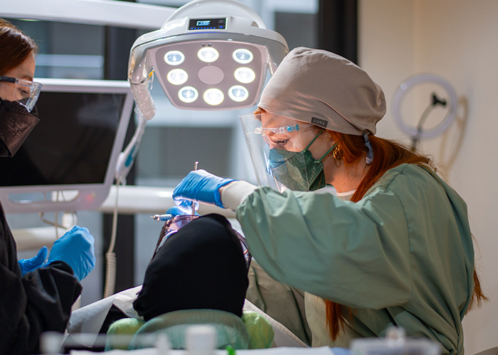 A clinician with a patient